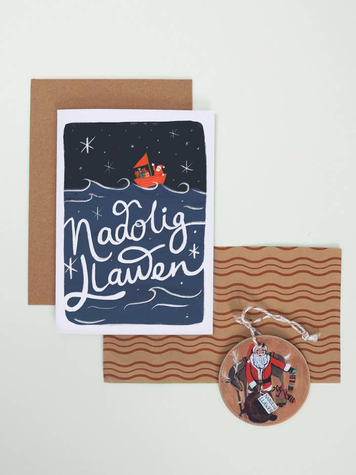 Nadolig LLawen Welsh Language Sailing Santa Christmas Card for wholesale by Jade Fisher