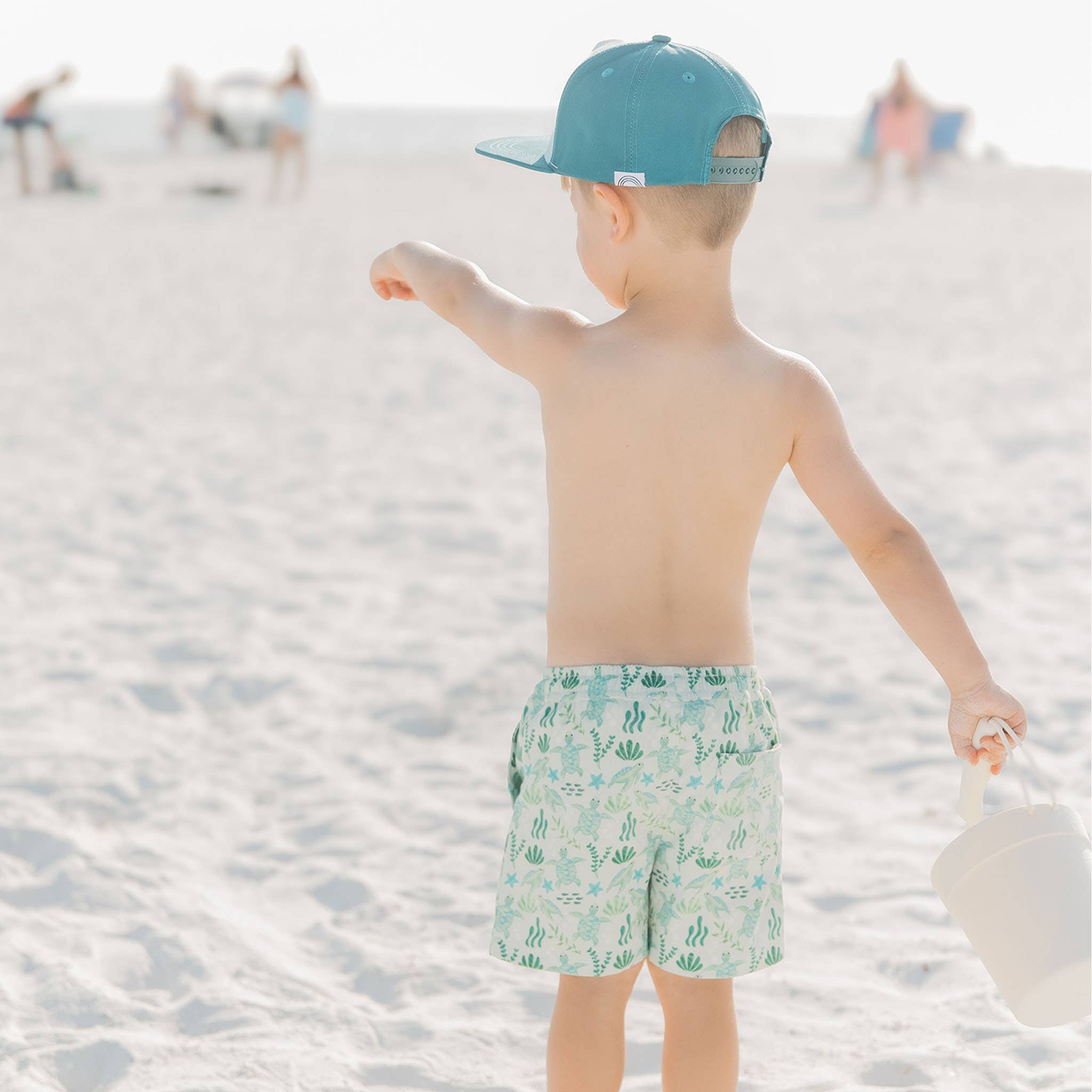 Green Save the Sea Turtles Boys Swim Trunks for wholesale on Faire2