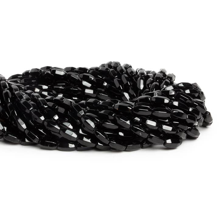 The Bead Traders – wholesale Beads – 9x4mm Black Onyx Faceted Tubes 15 inch 48 beads1