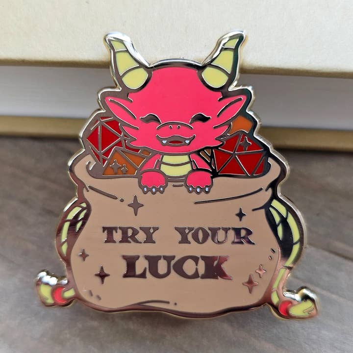 Dragon in Dice Bag Enamel Pin for wholesale by Nyanzilla