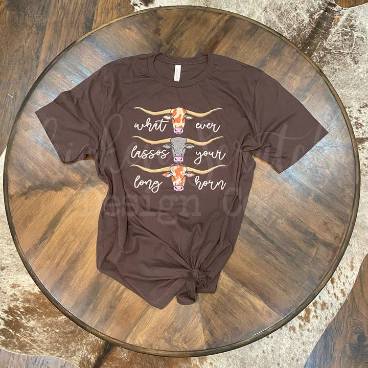 Whatever Lassos Your Longhorn Graphic Tee for wholesale by Chicken Scratch Design Co.