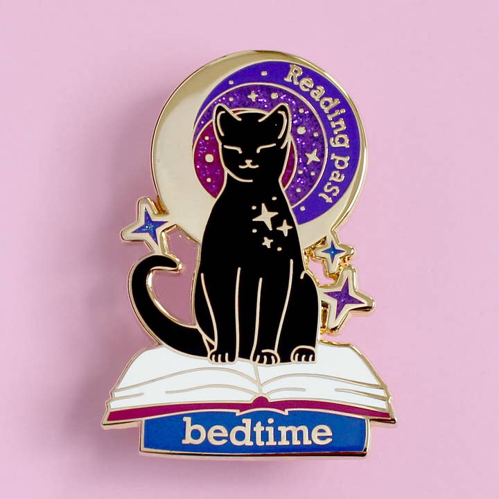 Reading Past Bedtime Cat Enamel Pin for wholesale by Glitter Punk