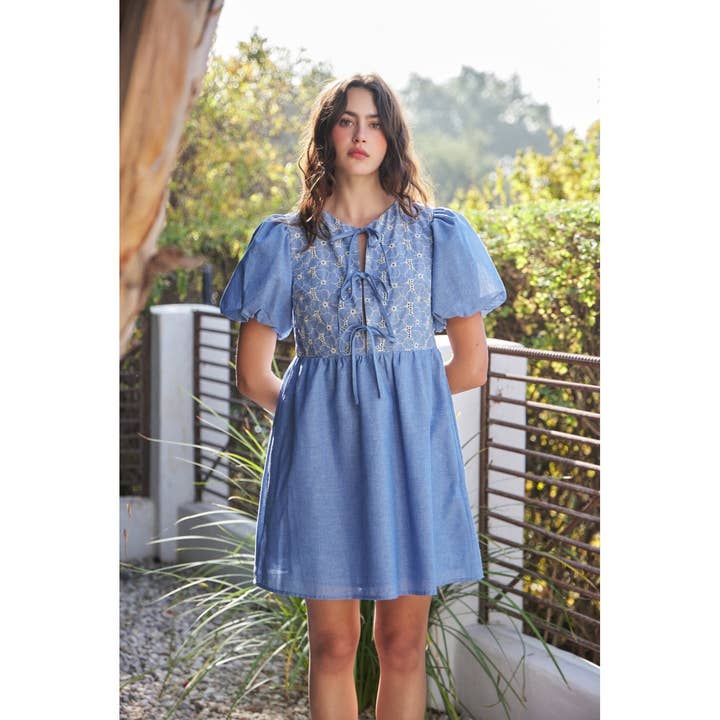 CHAMBRAY EYELET BUST MINI DRESS WITH FRONT BOW TIE DETAIL for wholesale on Faire