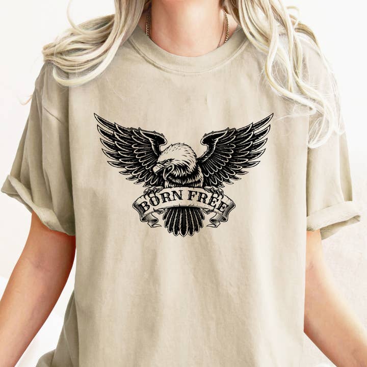 T-shirt con grafica BORN FREE per la vendita all'ingrosso da parte di Urban Edge Co.