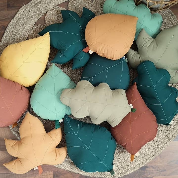 Decorative cushion in the shape of oak, birch and ash leaves for wholesale by The Butter Flying