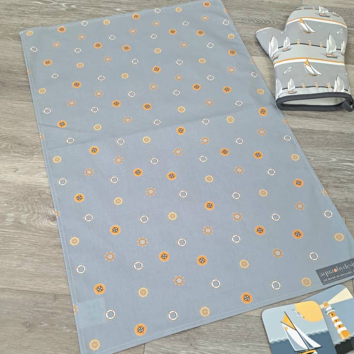 Tea Towel, Grey Nautical Wheels Design. for wholesale by Aqua by Design