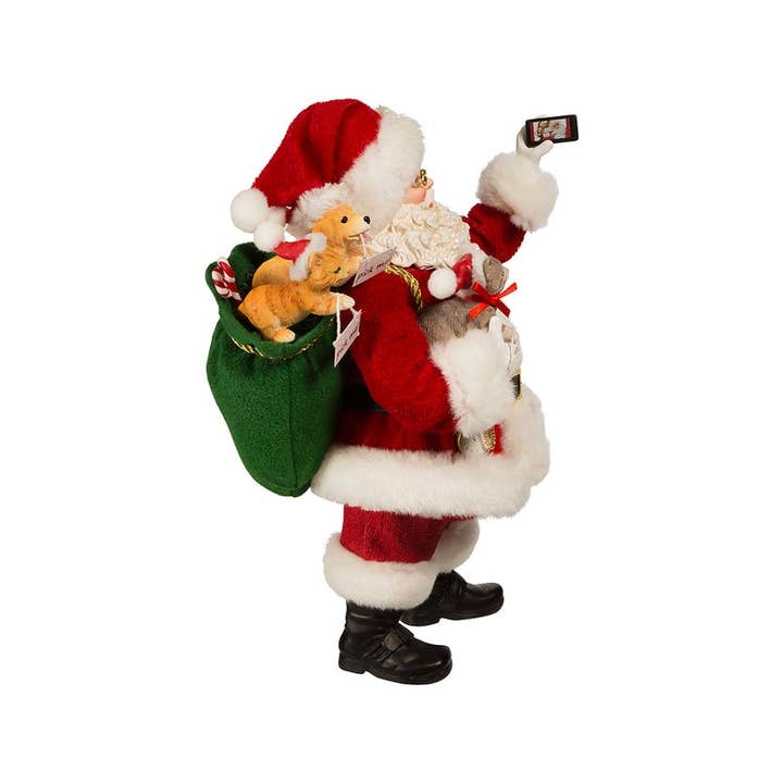 Kurt S. Adler, Inc. - Wholesale Christmas Decoration - 11"Fabriche Santa Taking Selfie