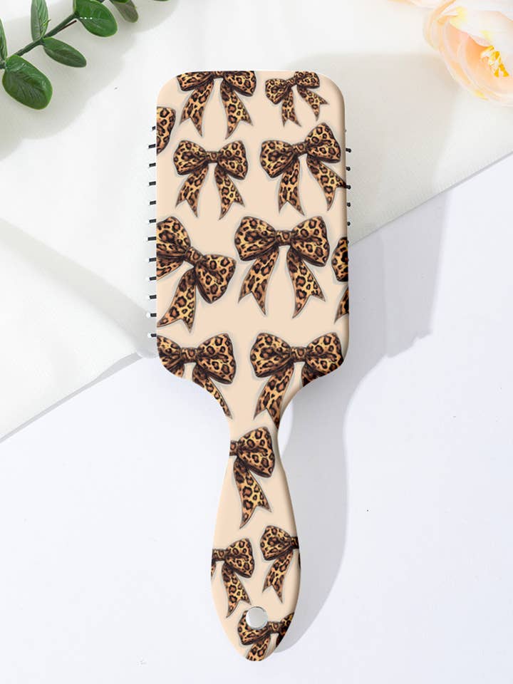 Peigne à coussin d'air imprimé léopard et nœud pour la vente par 1 the Woman