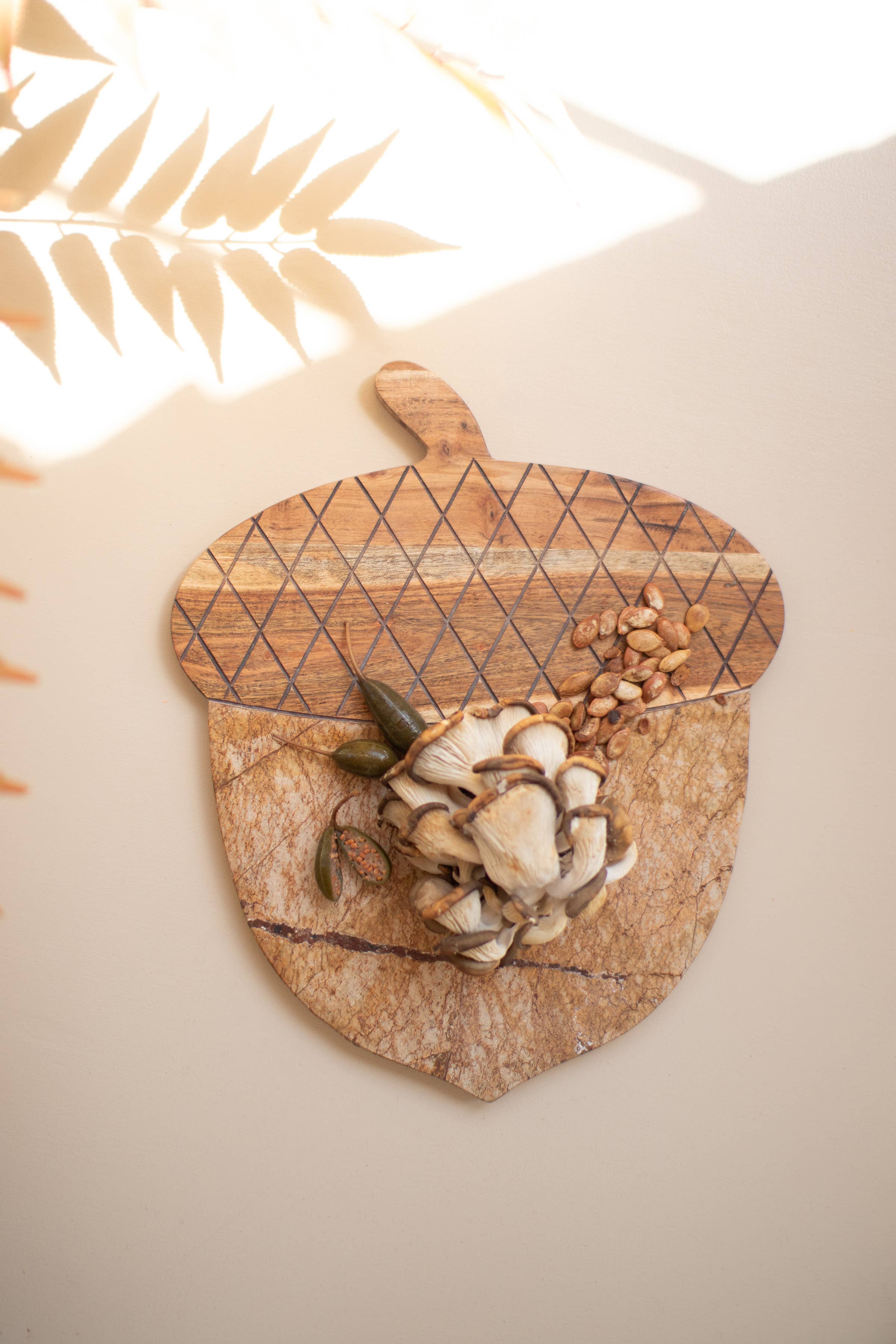 Brown ACACIA WOOD AND MARBLE ACORN SERVING BOARD for wholesale on Faire2