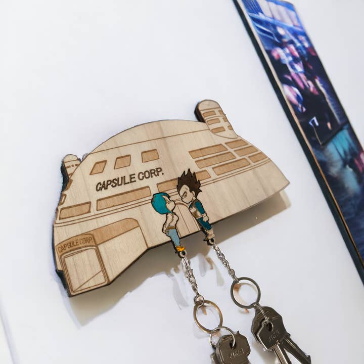 Studio Rima – wholesale Keychain – Unisex – Vegeta & Bulma Capsule Corp Keychain Wall Mounted Key Holder