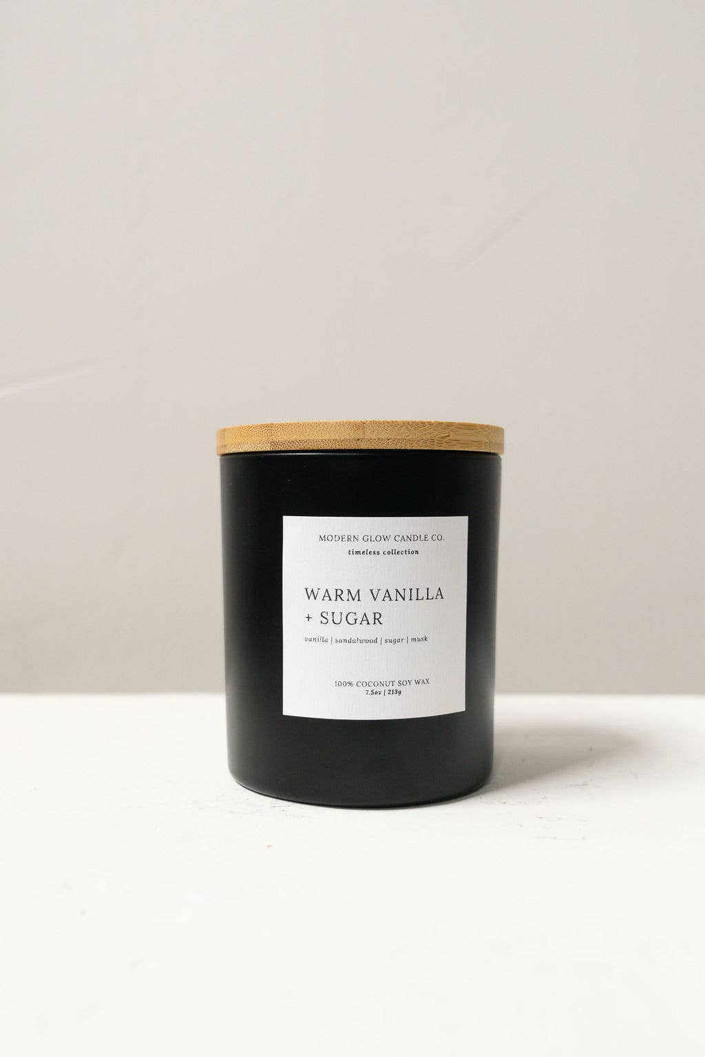 Modern Glow Candle Co. - Wholesale Jar/Filled Candle - Warm Vanilla + Sugar - 7oz Matte Black Soy Candle1