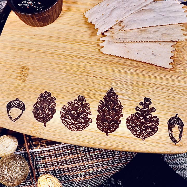 Pine Cone Acorn Winter Snow Bamboo Cutting Serving Charcuter for wholesale by Rustic Cedar Co