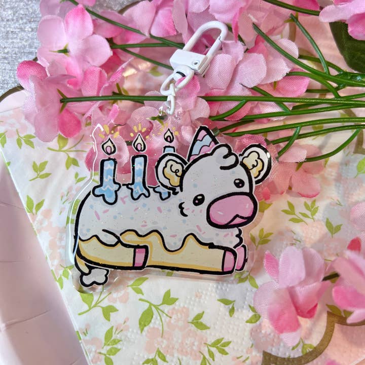 Icing the Birthday Cow! ~ Glitter Acrylic Keychain Charm for wholesale by Woolblossom