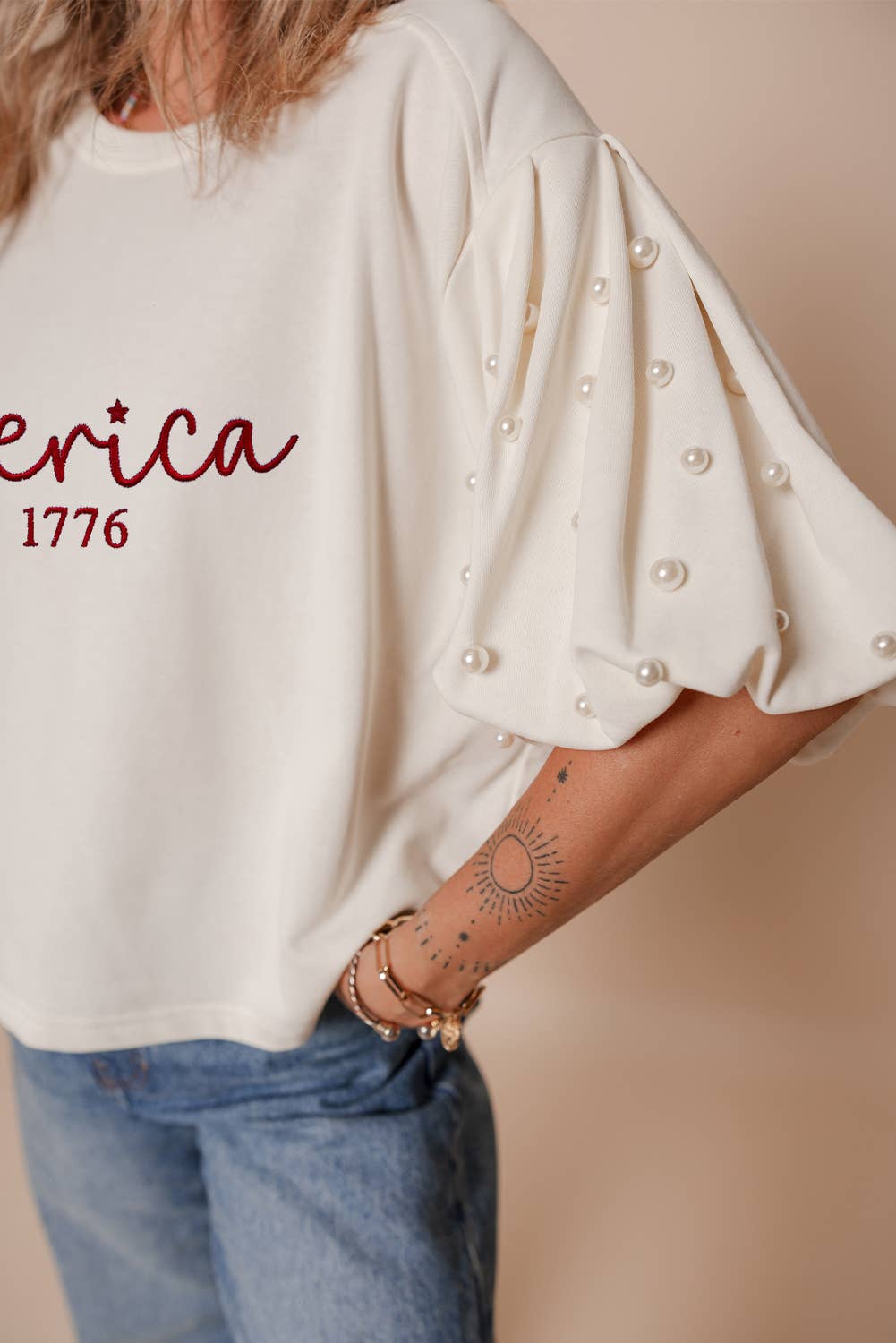 White America EST 1776 Embroidered Pearl Beaded Sleeve T Shirt for wholesale on Faire