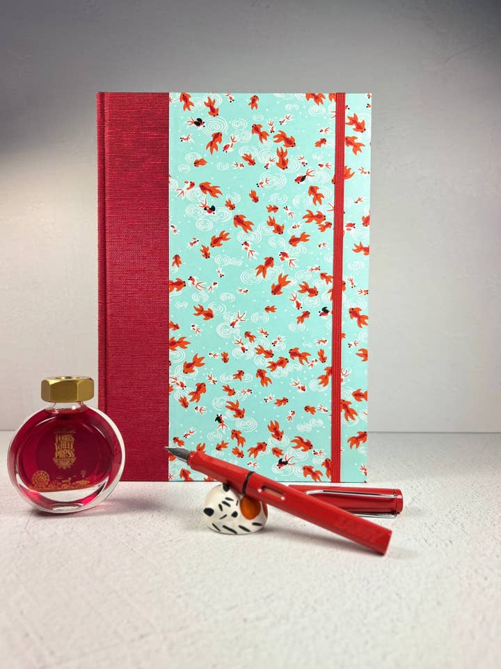 B5 Hardcover Notebook finished in Scarlet Red Japanese Bookcloth and Red/Orange Koi Fish on Aqua Chiyogami Paper for wholesale by Graystorm Studio