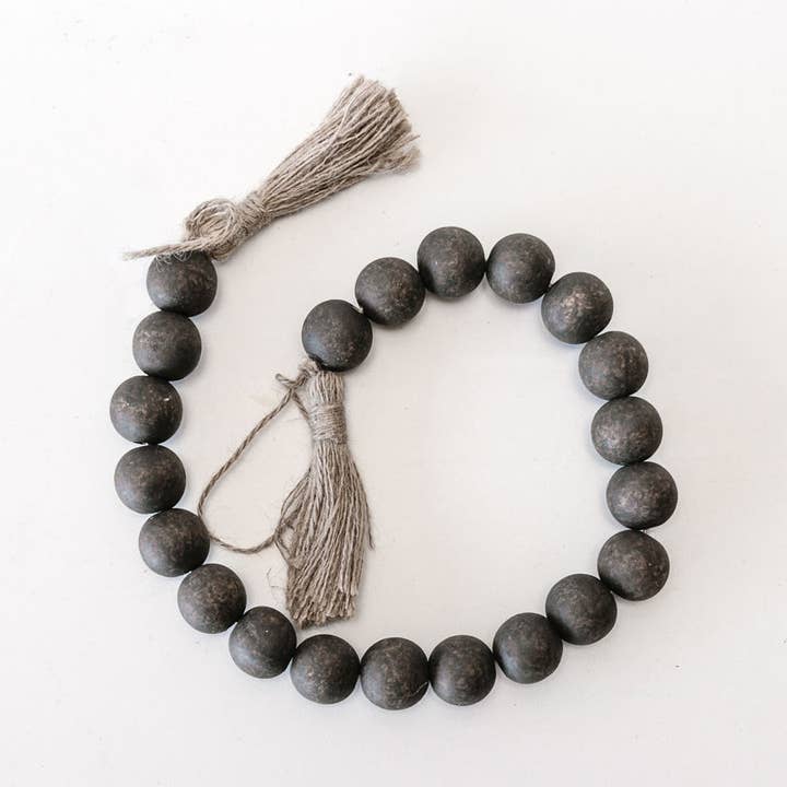 15109 - 24x1 wood bead garland w/tassels CHRISTMAS Decor for wholesale by Devanie At Home (Formerly Adams & Co.)