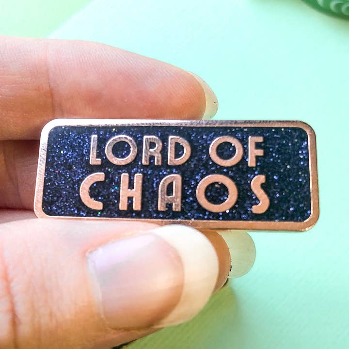 Épinglette en émail Lord of Chaos | Épinglette noire à paillettes pour la vente par Belle's Books & Candles