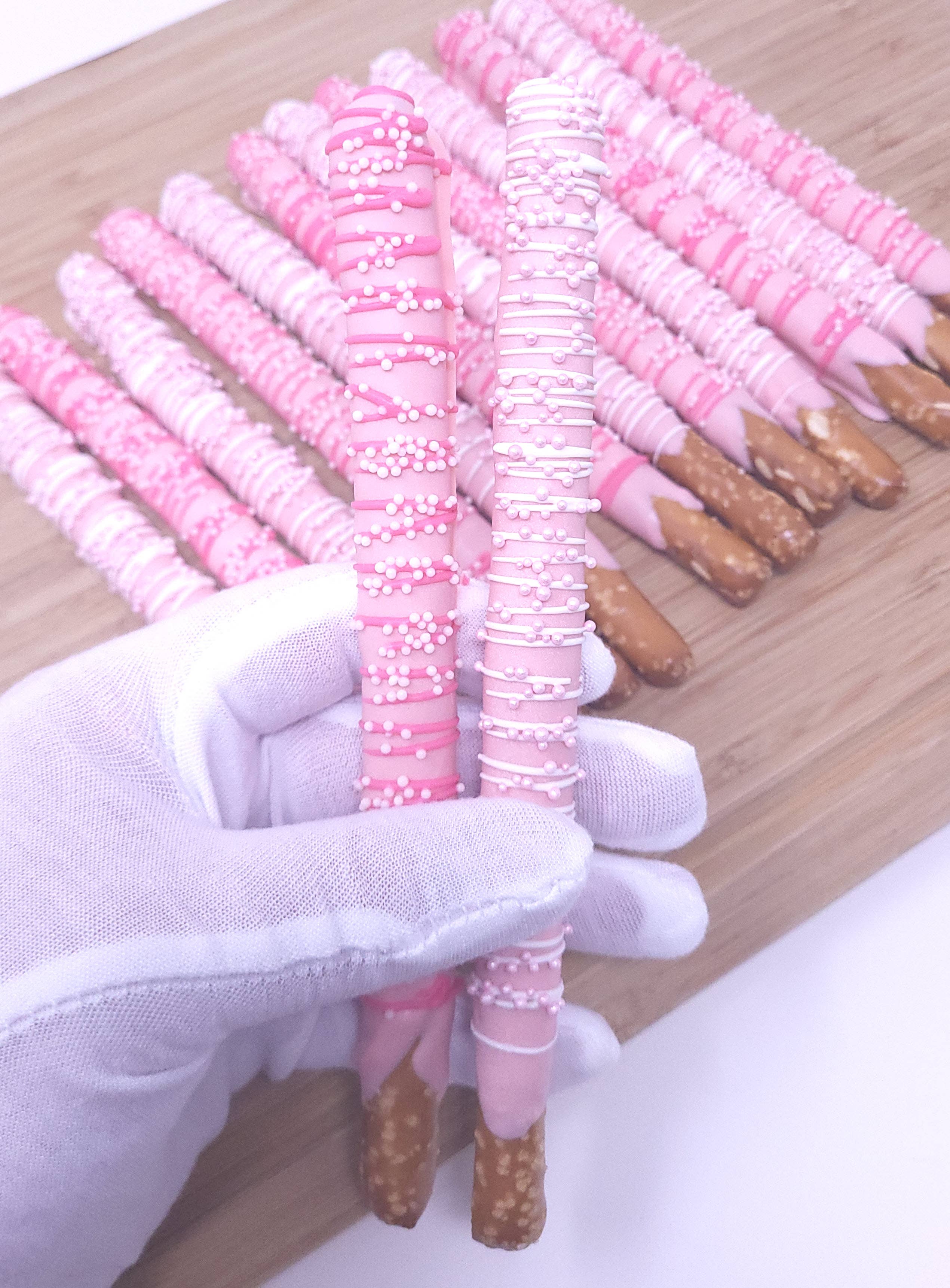 Wild Angel Treats, LLC - Wholesale Chocolate Covered Sweets - Chocolate Dipped Pretzel Rods - Pink1