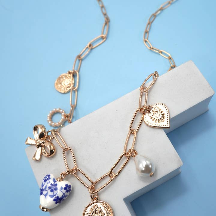 Gold CERAMIC PORCELAIN BOW HEART CHARM LINK NECKLACE | 80N91547 for wholesale on Faire