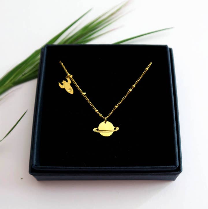 Yellow gold Mini planet Saturn and mini rocket necklace for wholesale on Faire0
