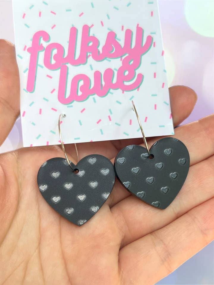 Matte black hearts on hearts acrylic earrings for wholesale by folksylove