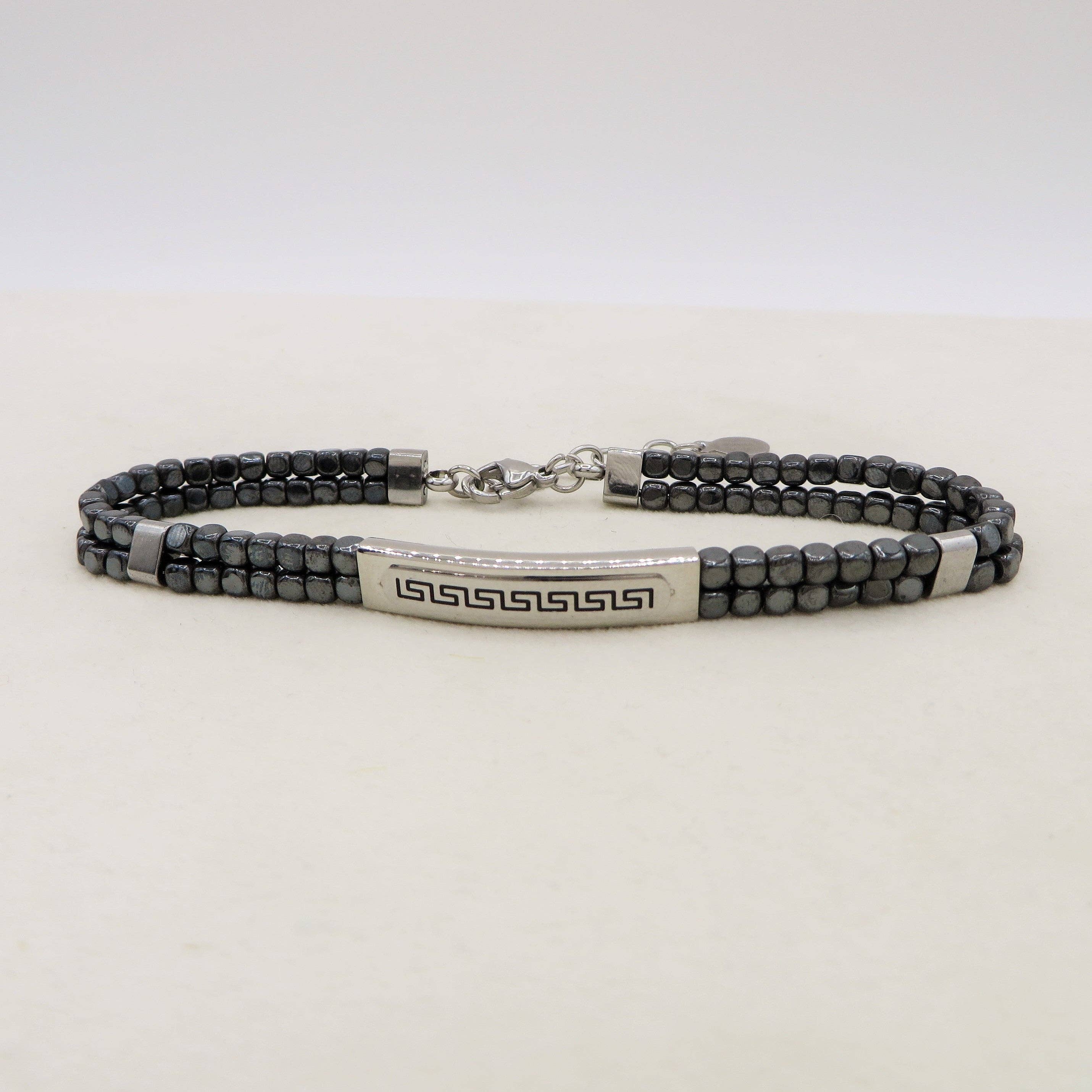 ARES Bracciale uomo  Targhetta con greche e cubetti in ematite -  ACCIAIO INOSSIDABILE for wholesale on Faire2