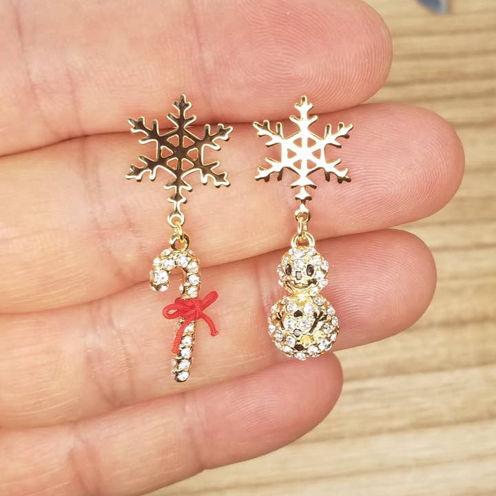 Snow Flake Earring With Mismatched Dangle Snowman And Cane for wholesale by BETTYOH INC