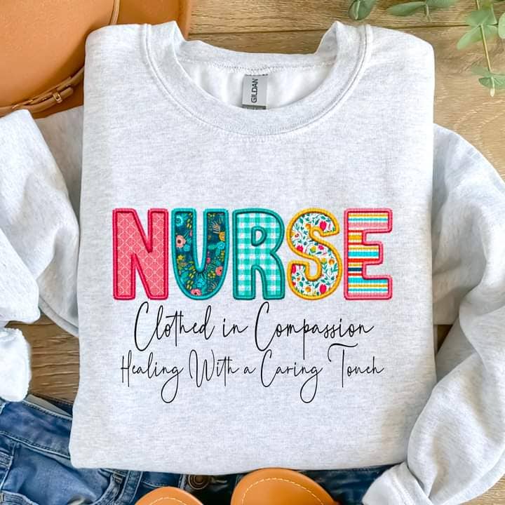 Nurse Clothed in Compassion Tee or Crew for wholesale by Hello Sunshine Boutique