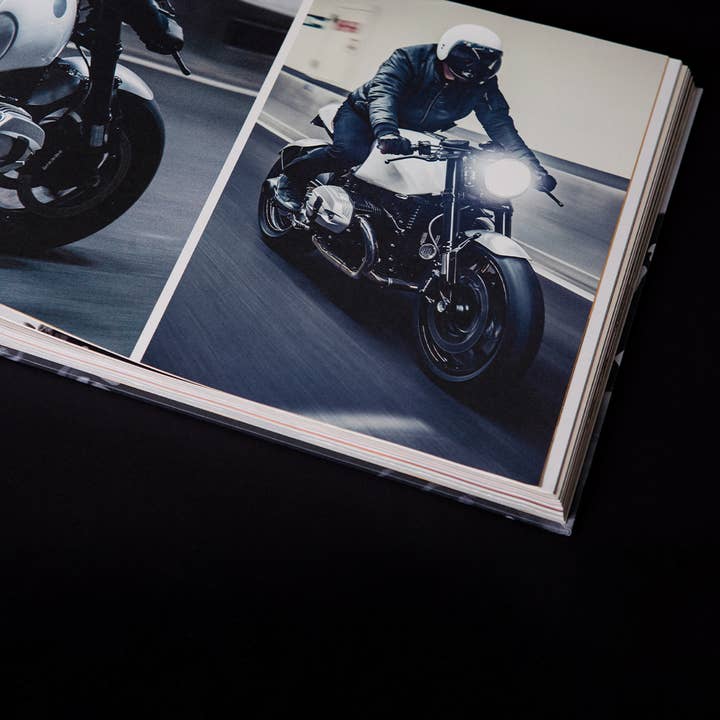 Black IN BENZIN VERITAS - The History of Deus Custom Motorcycles for wholesale on Faire