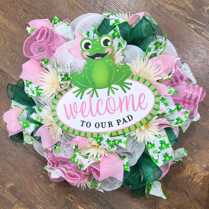 Welcome to our Pad Frog Deco Mesh and Gerbera Daisy Wreath for wholesale by An Array of Wreaths, LLC