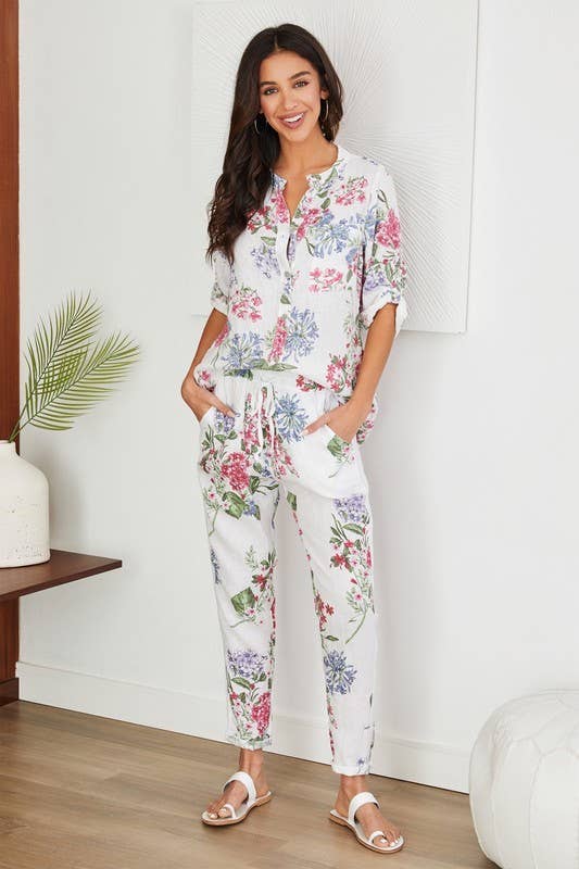 Wit LINNEN BROEK MET BLOEMENPRINT EN PAILLETTEN ZIJSTREEP (16-08-FLORAL) voor groothandel op Faire3