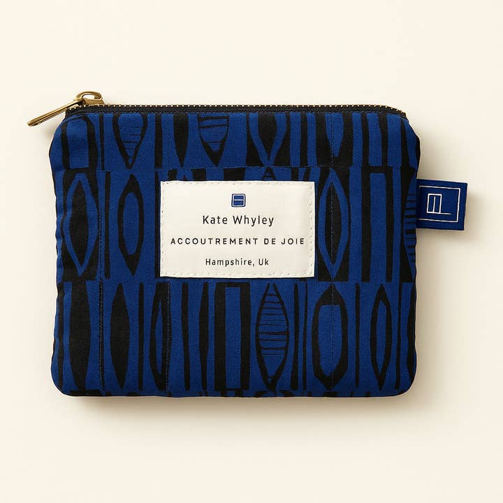 Bold blue Courage print design accessories pouch 3 sizes for wholesale by Kate Whyley