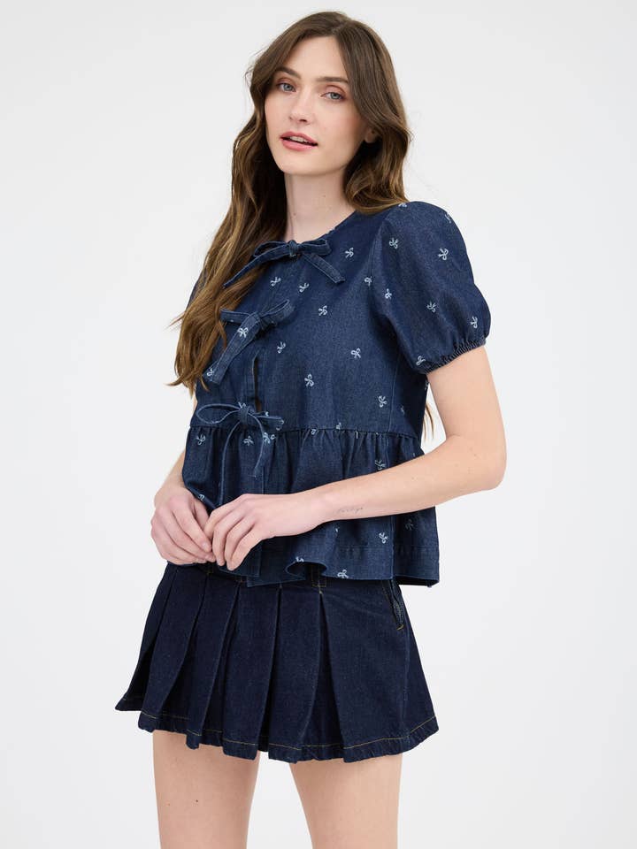 DENIM BOW PRINT PUFF SLEEVE FRONT SELF TIE RUFFLE HEM BLOUSE-BACKO for wholesale on Faire