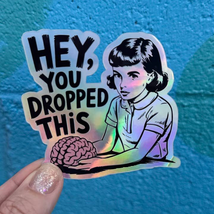 Hilarious Humanitarian - Wholesale Sticker - Hey, You Dropped This Holographic Sticker1