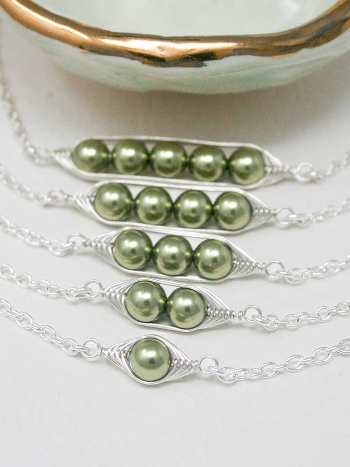 Peas in a pod bracelet, Green peas. for wholesale by Rising Jewelry