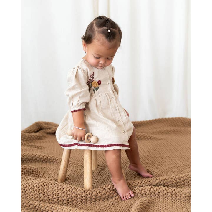 Natural Ravello Embroidered Baby Dress & Bloomer (Linen Blend) for wholesale on Faire2