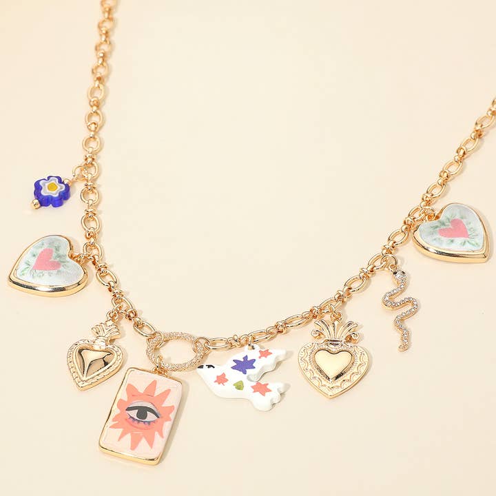 HEMMELIG BOKS_Kraftig blandet symbolisk charm station halskæde for engroshandel hos Sensibling Corp.