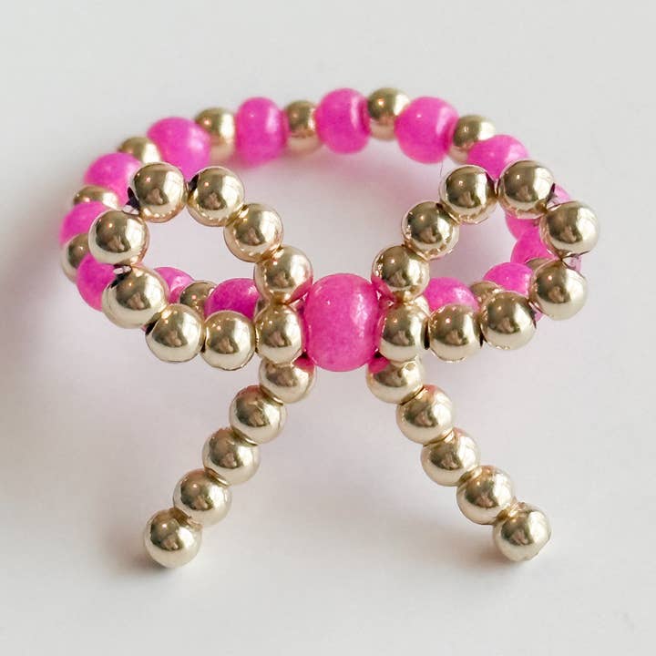 Bague Lilli nœud rose vif et or pour la vente par Gardenia Co