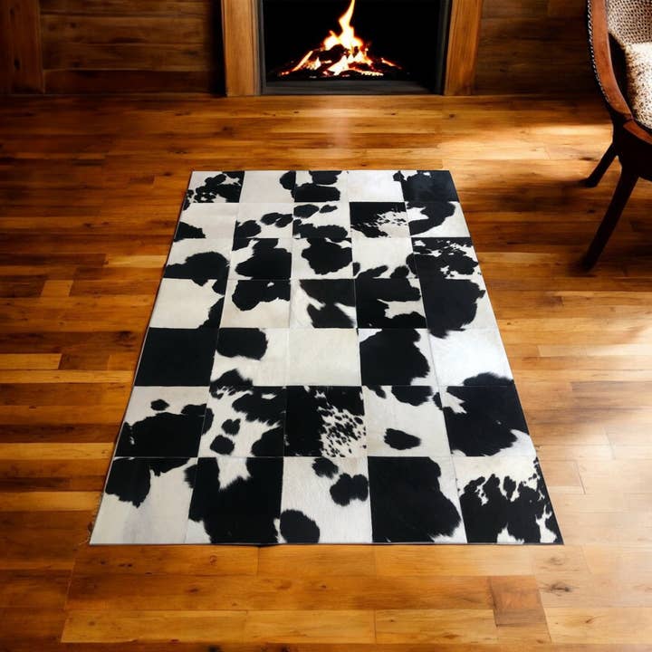 Alfombra de retazos de piel de vaca con estampado de vaca en blanco y negro para venta al por mayor de Karelias And Sons
