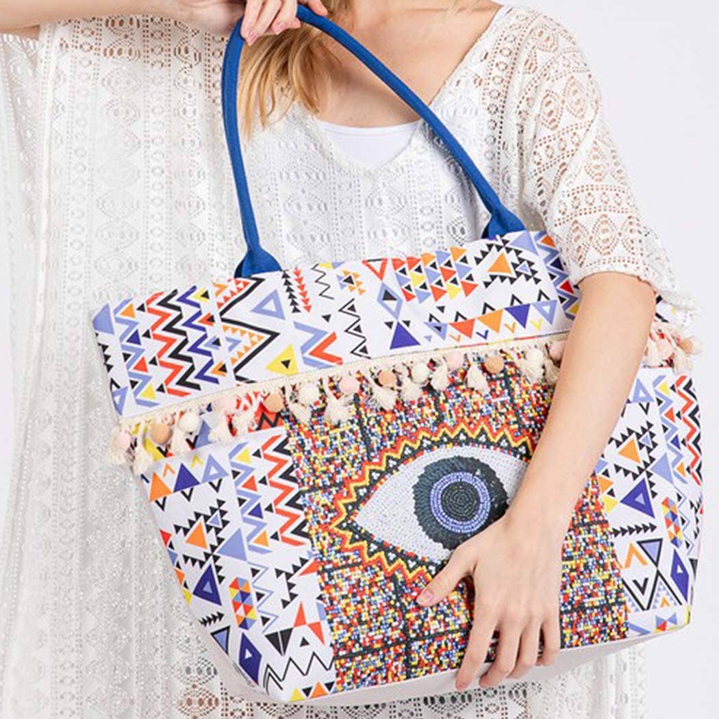 MT  EVIL EYE BOHO PRINT POM POM FRINGE TOTE BAG for wholesale on Faire4