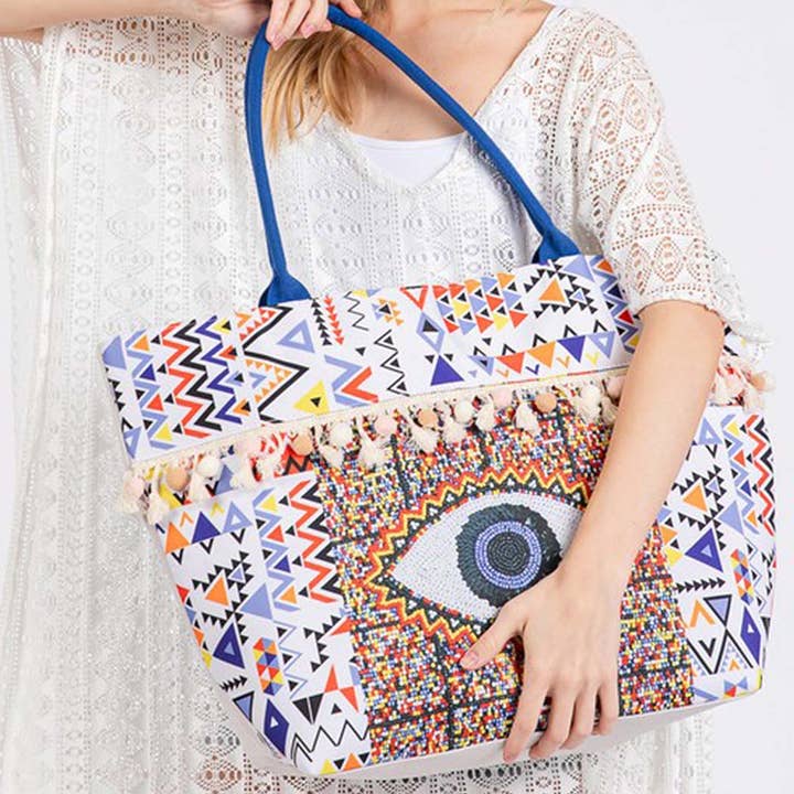 MT EVIL EYE BOHO PRINT POM POM FRINGE TOTE BAG for wholesale on Faire4
