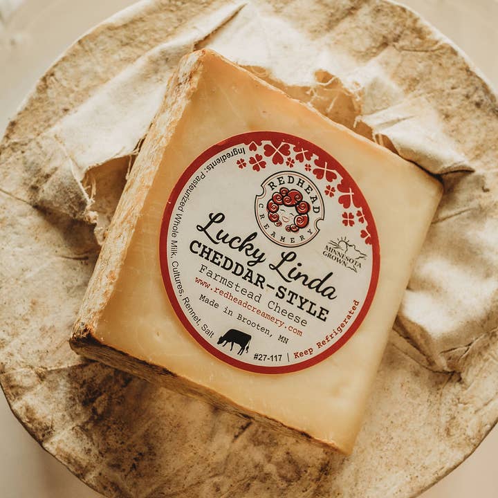Lucky Linda Clothbound Cheddar Wheel for wholesale by Redhead Creamery