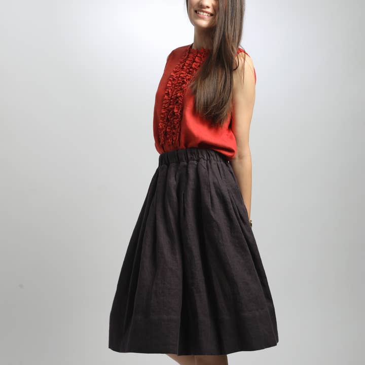 Falda midi plisada hasta la rodilla MIMI con bolsillos para venta al por mayor de Knotium