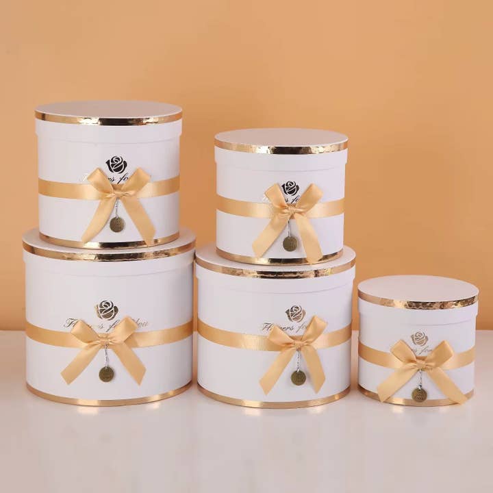 Round Flower Gift Box with Bow and Medaillon and other Purchase Wholesale m c. Free Returns & Net 60 Terms on Faire trending on Faire.