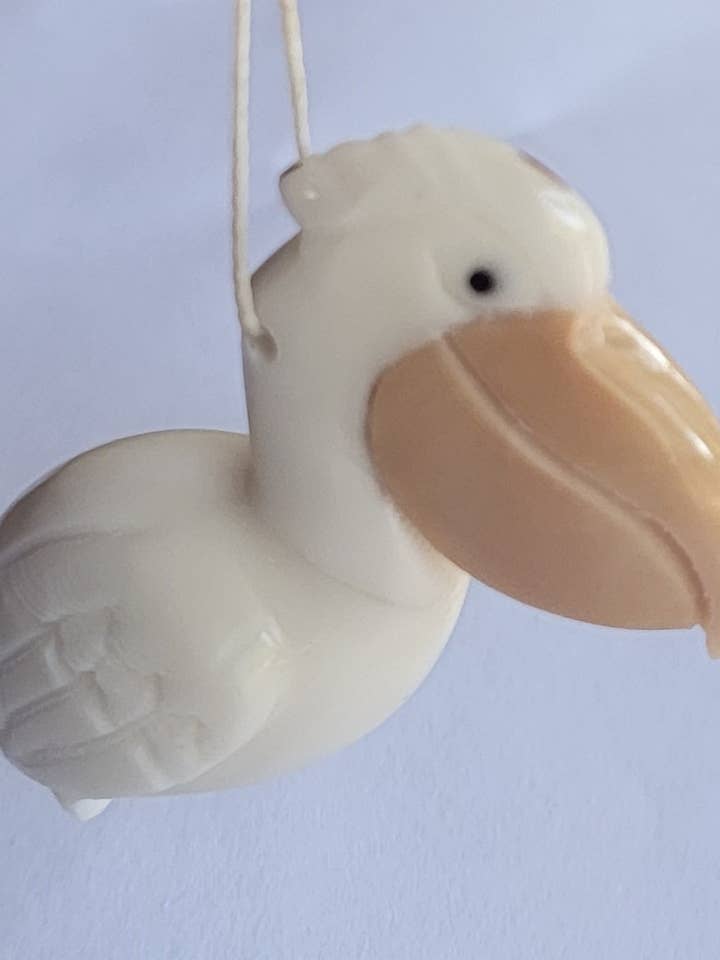 Pelican Tagua Ornament / suncatcher for wholesale by Pampeana