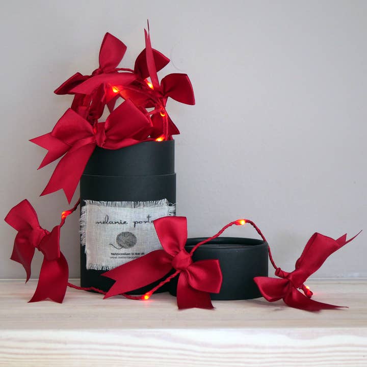 Satin Bow Fairy Lights - Christmas Decoration and other Purchase Wholesale porter green. Free Returns & Net 60 Terms on Faire trending on Faire.