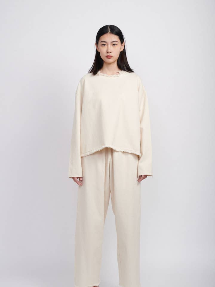 PANTALON EN JEAN AMPLE - CRÈME pour la vente par Ashley Rowe