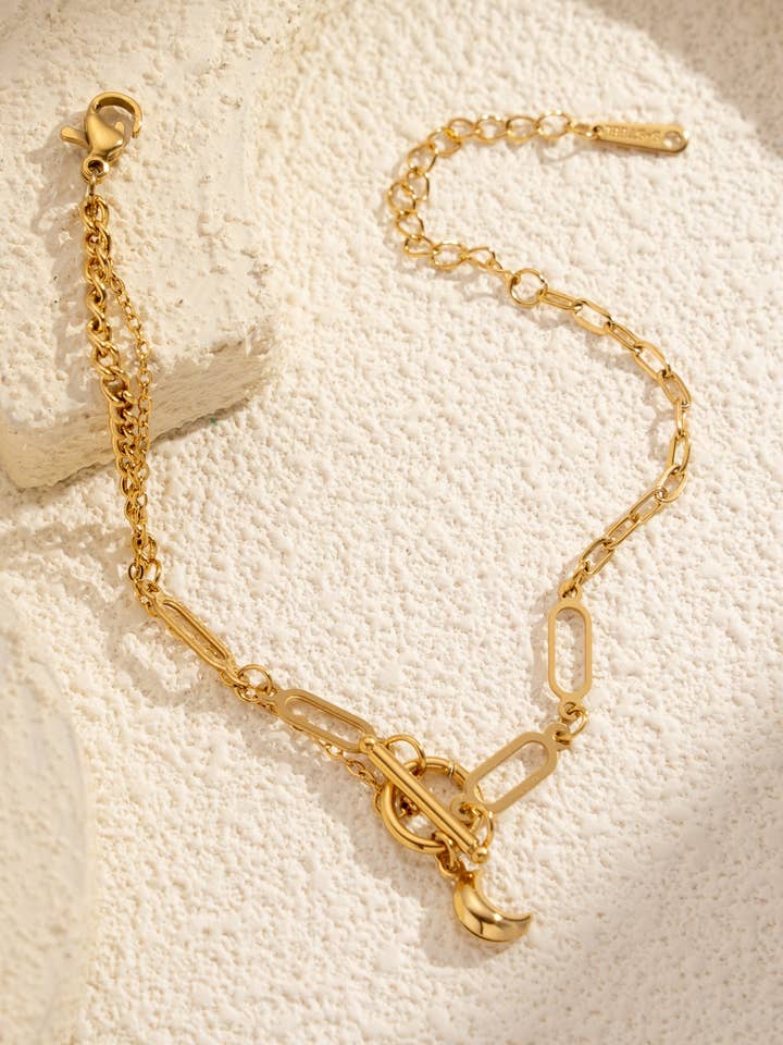Golden Bracelet with Gradient Links and Mystic Moon Charm for wholesale by COSMOS