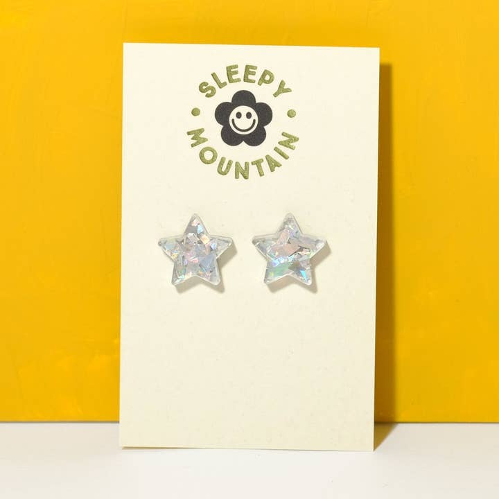 Star stud earrings iridescent silver glitter for wholesale by Sleepy Mountain
