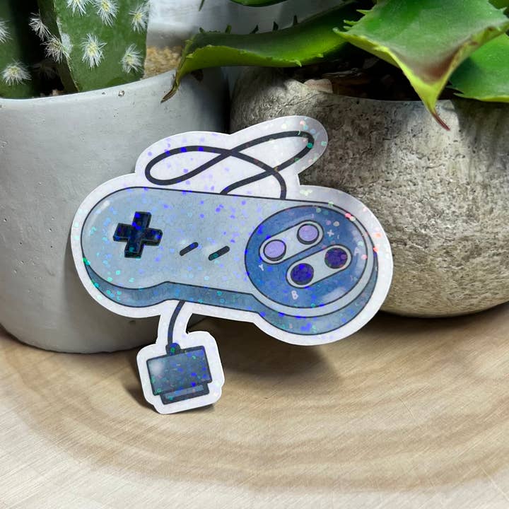 Holographic Super Nintendo Control 90s Nostalgia Sticker for wholesale by Simply Evelyn Co